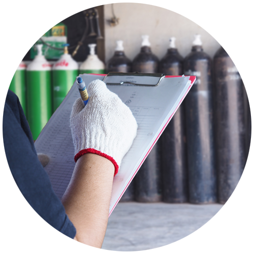 Circle with gloved hand writing on clipboard and compressed air tanks in background