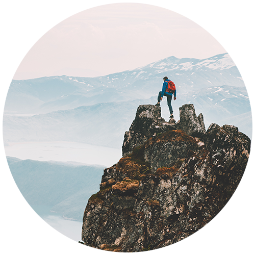 A hiker on top of a mountain as a button for Travel Insured International